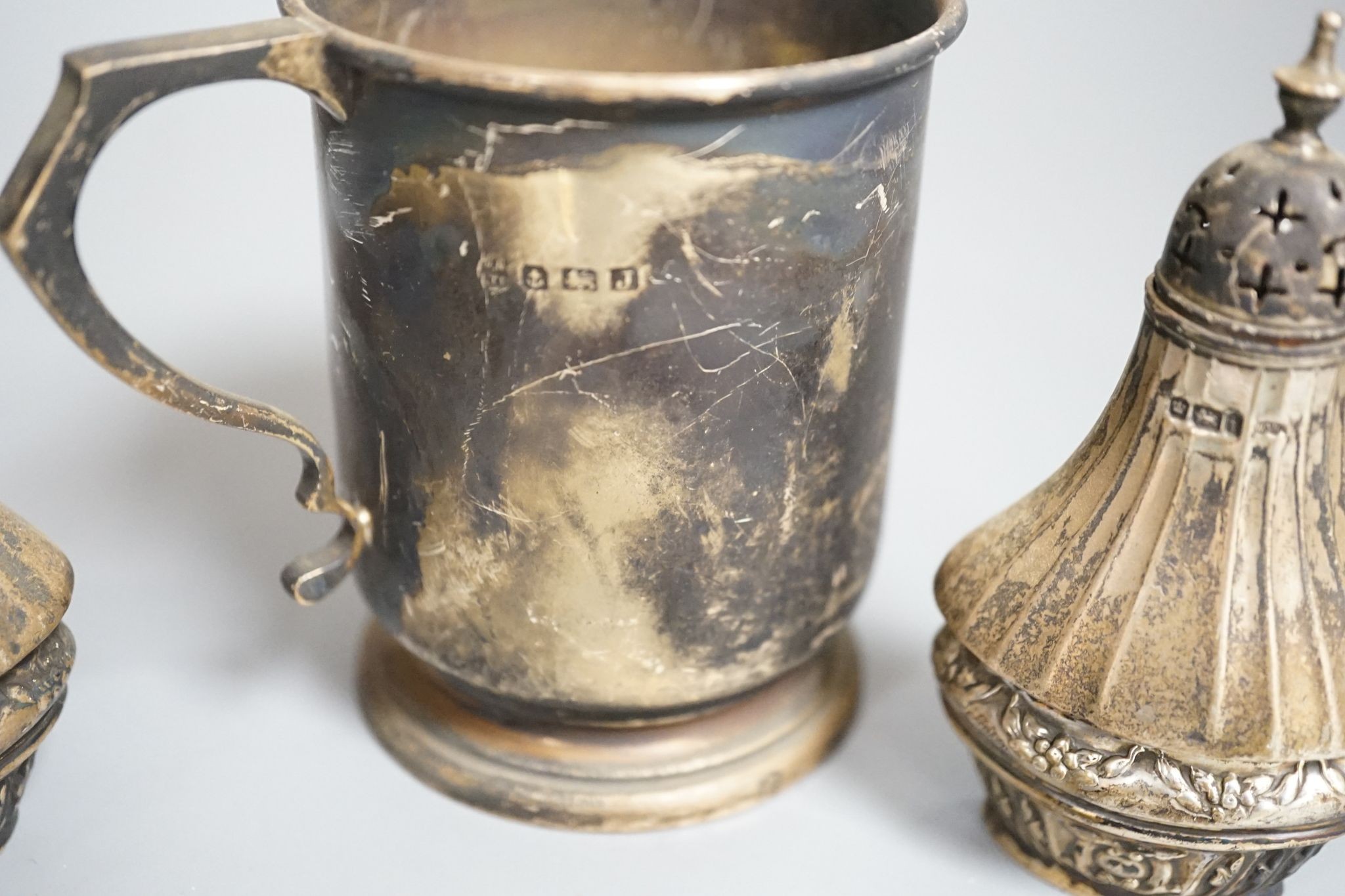 A 1930's silver christening mug, 85mm and three other items including a 9ct and white metal ring shank.